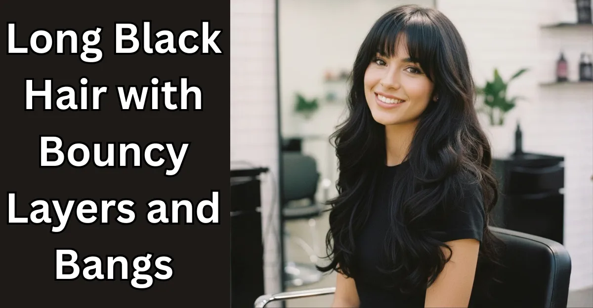 A smiling woman with long, voluminous black hair featuring bouncy, curled layers and full, straight-across bangs.