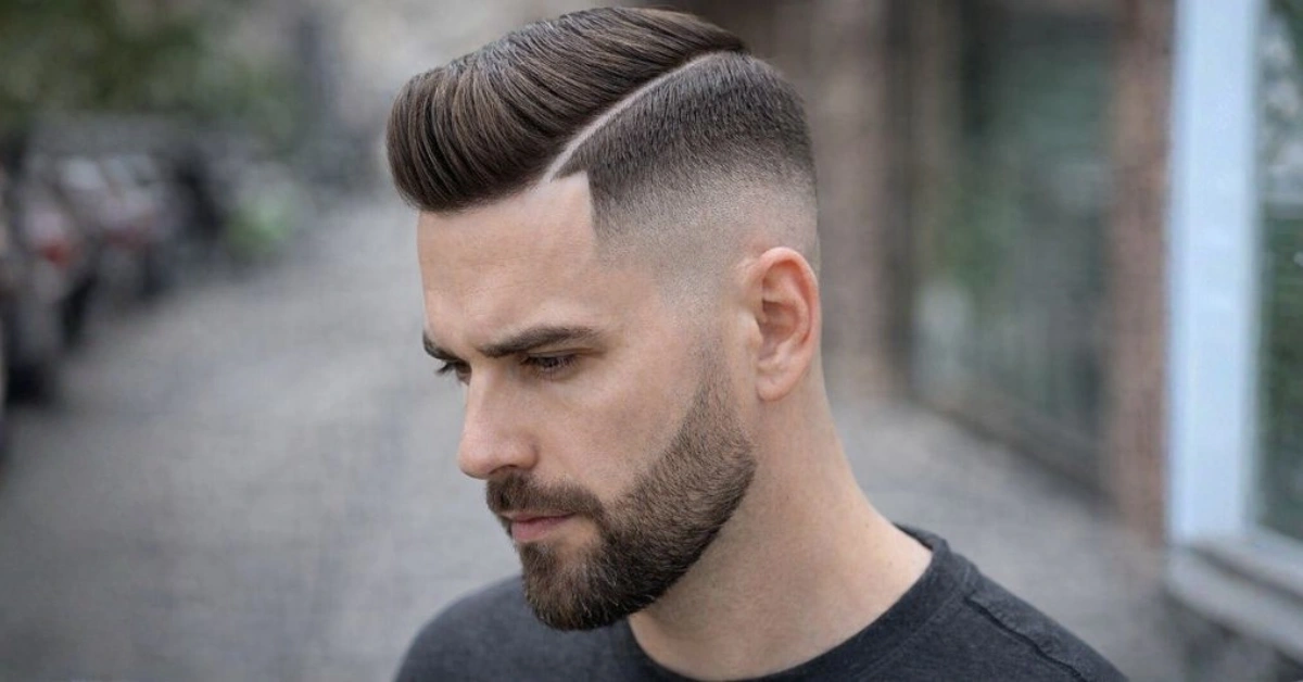 Side Part Skin Fade with Thick Hard Part and Blended Beard