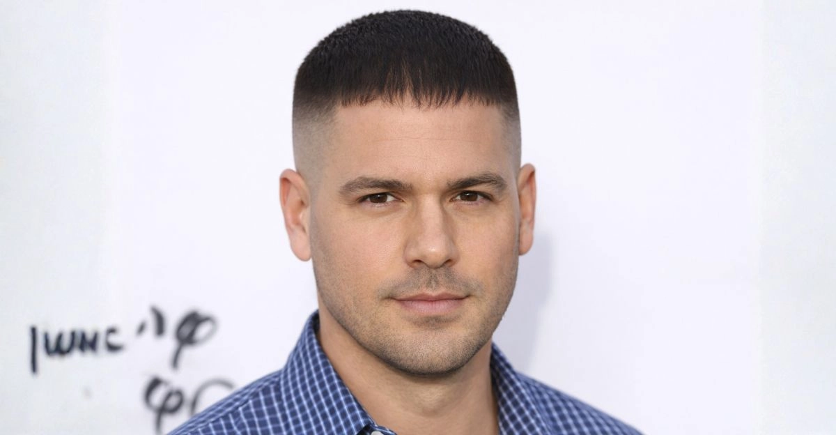 Caesar cut with short even length and straight fringe, helping soften a receding hairline.