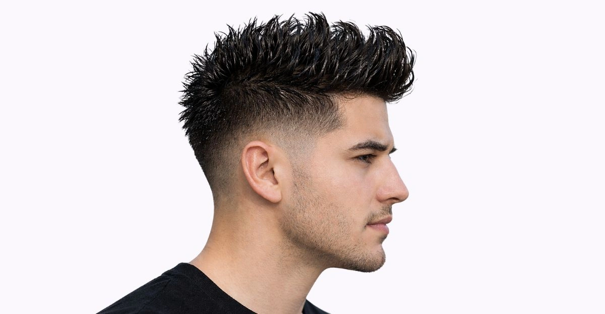 Man with faux hawk wet look featuring shiny raised center strip and faded sides.